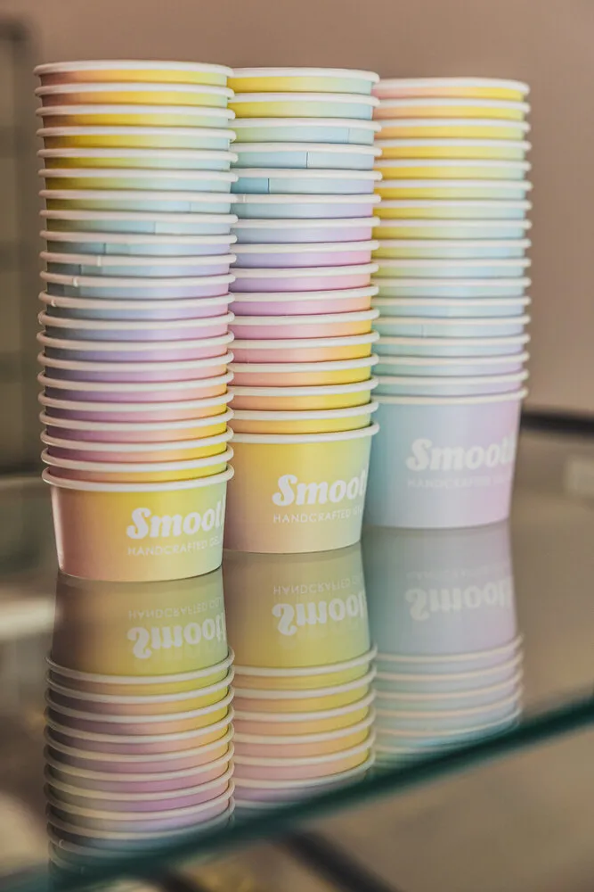Pastel Smooth gelato cups stacked on the back shelf.