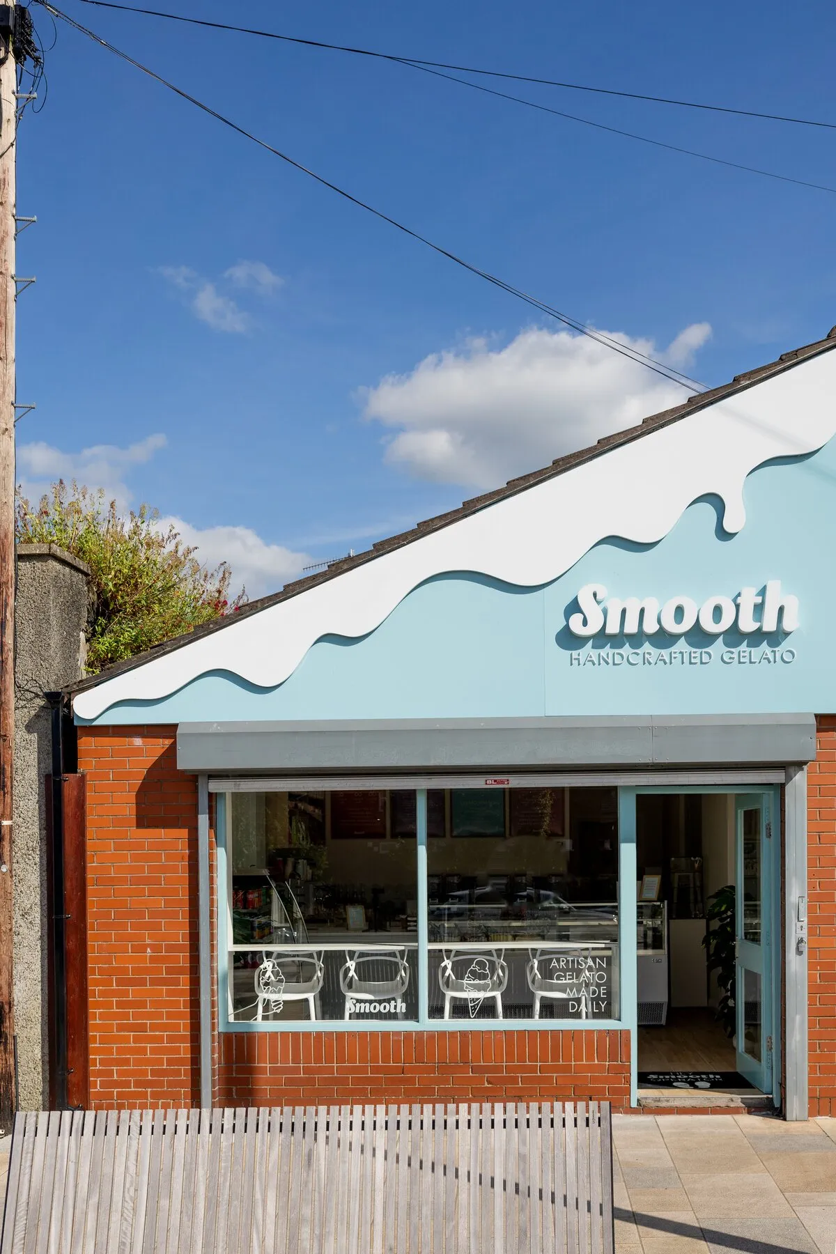 The Smooth Gelato shopfront in Banbridge on a sunny day — melting-drip fascia sign above the big shop window.
